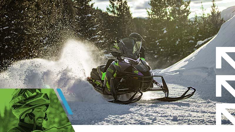 Trail and Utility vehicle driving through snow